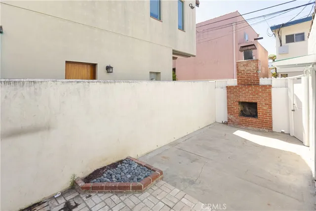 a view of an empty room with a fireplace