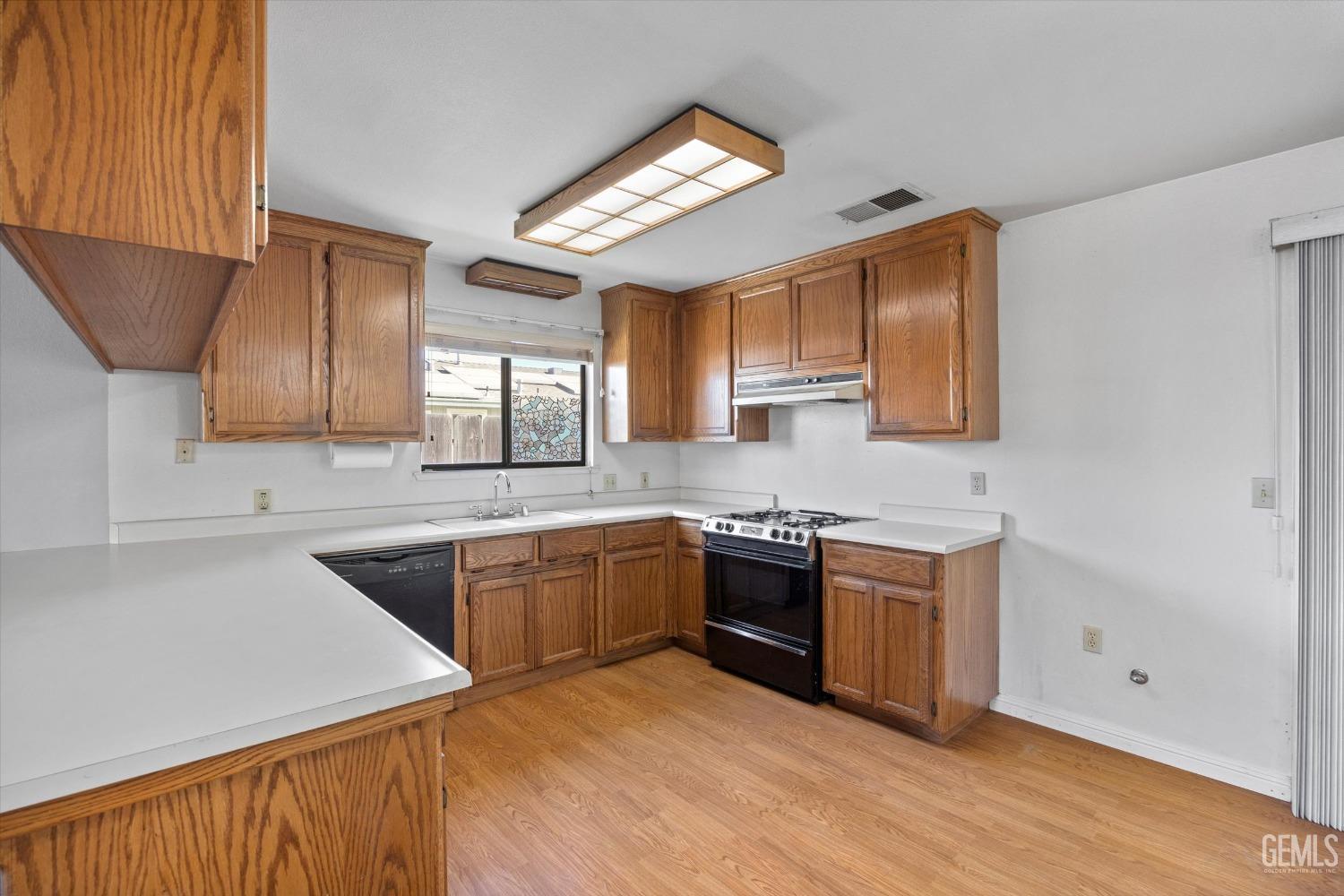 Undisclosed Address Chowchilla, CA 93610 - Photo 13 of 29 a kitchen with stainless steel appliances granite countertop a sink stove and refrigerator