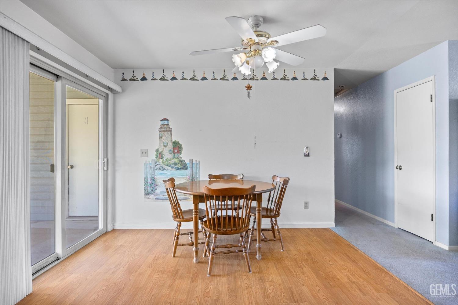 Undisclosed Address Chowchilla, CA 93610 - Photo 16 of 29 a view of a dining room with furniture wooden floor and chandelier