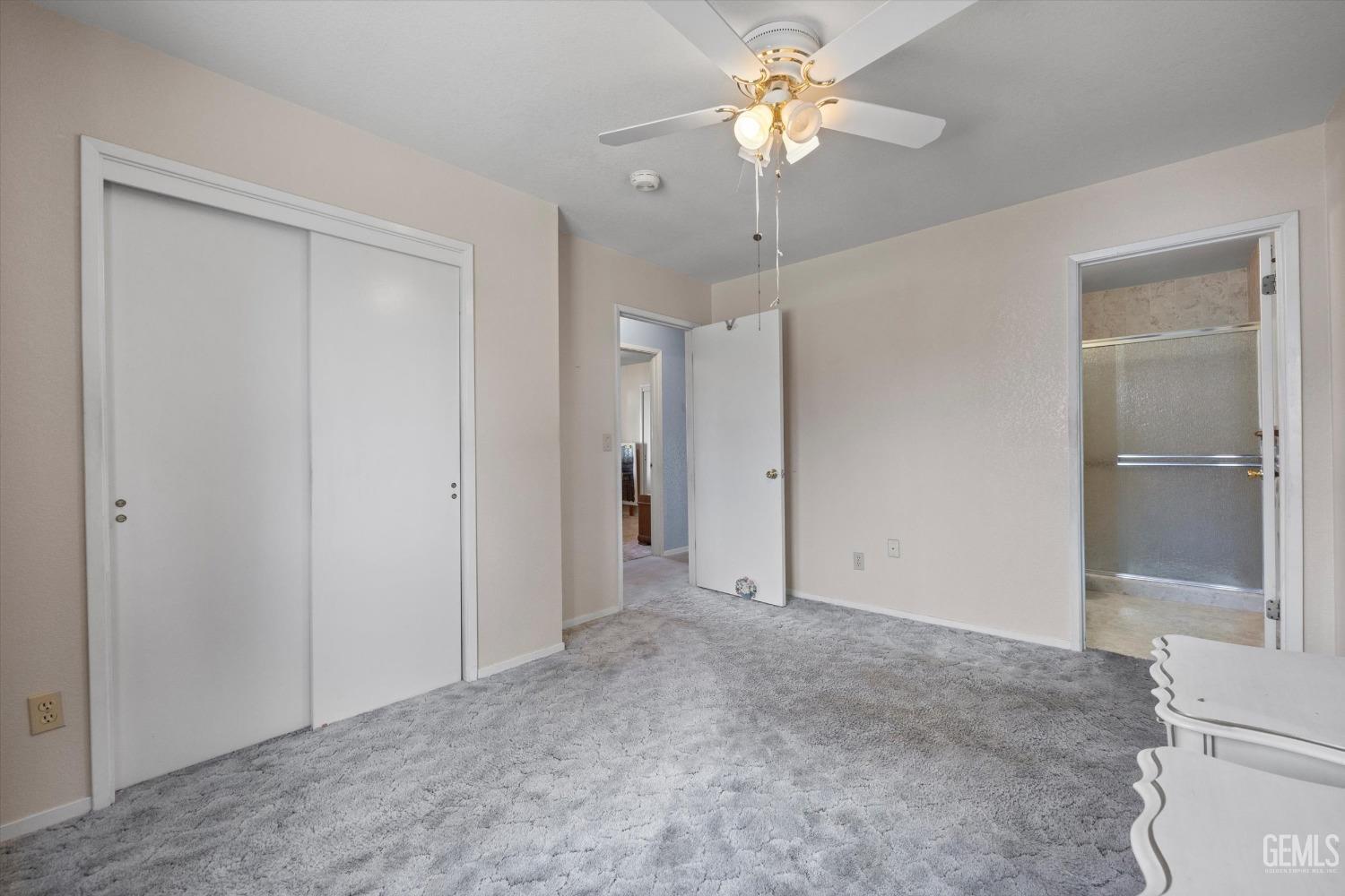Undisclosed Address Chowchilla, CA 93610 - Photo 18 of 29 a view of an empty room with a chandelier fan