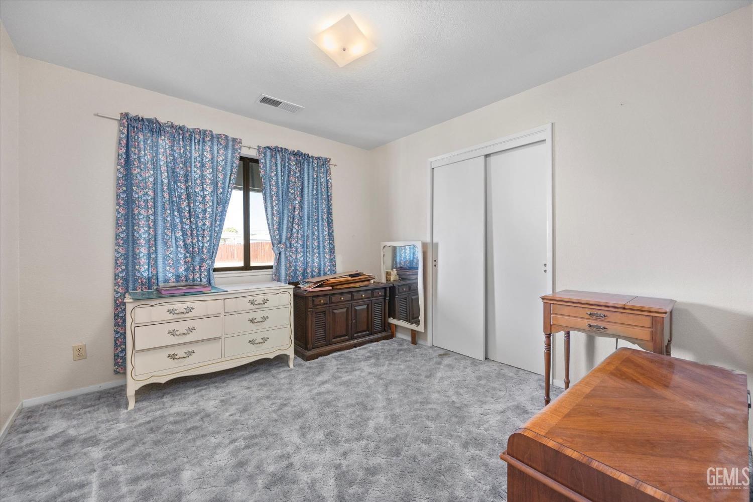 Undisclosed Address Chowchilla, CA 93610 - Photo 20 of 29 a room with furniture and a dresser