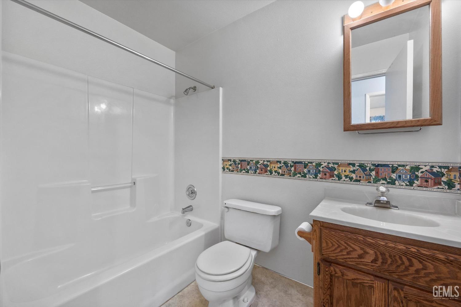 Undisclosed Address Chowchilla, CA 93610 - Photo 22 of 29 a bathroom with a sink toilet vanity and shower
