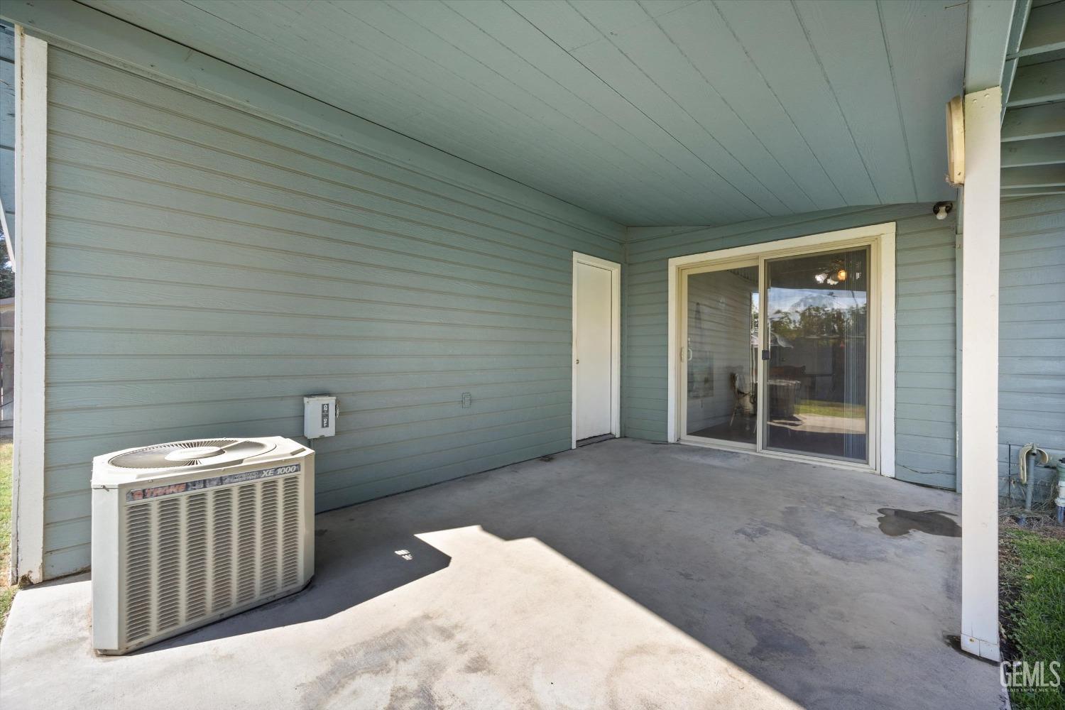 Undisclosed Address Chowchilla, CA 93610 - Photo 26 of 29 a view of a door and chair in a room