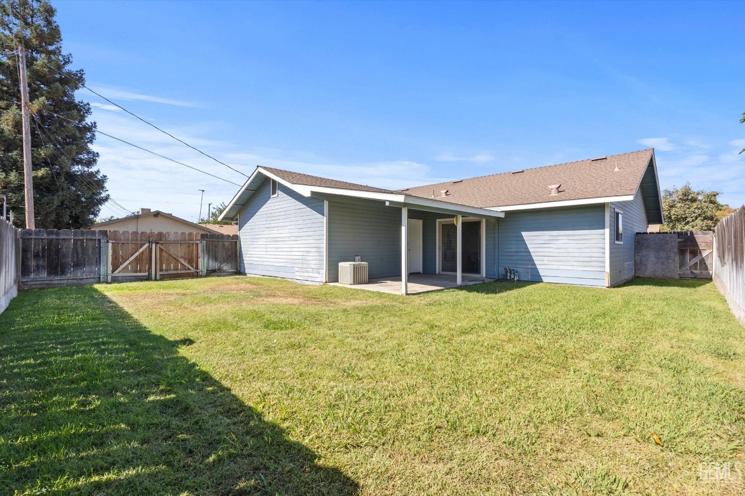 Undisclosed Address Chowchilla, CA 93610 - Photo 28 of 29 a front view of house with yard and green space