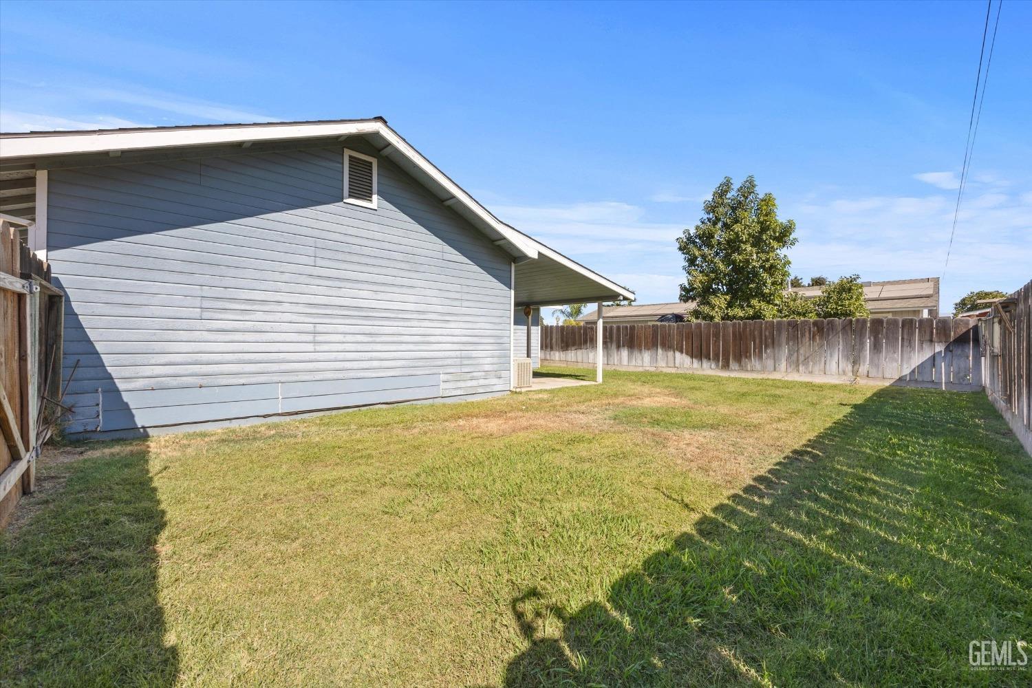 Undisclosed Address Chowchilla, CA 93610 - Photo 29 of 29 a front view of a house with a yard