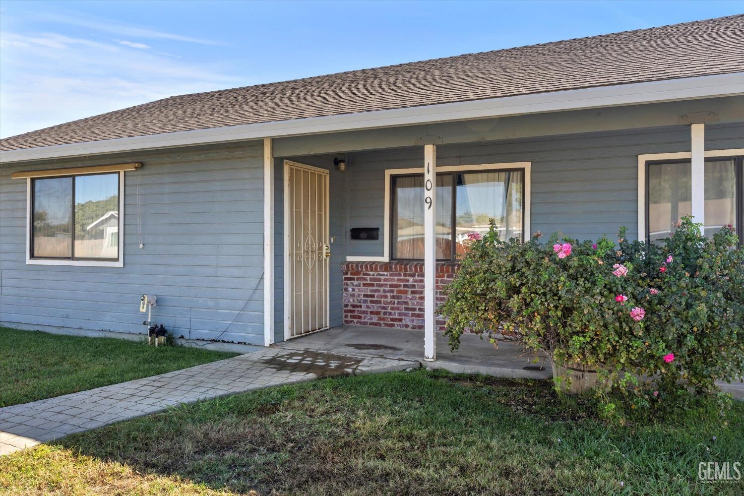 Undisclosed Address Chowchilla, CA 93610 - Photo 4 of 29 front view of a house with a yard