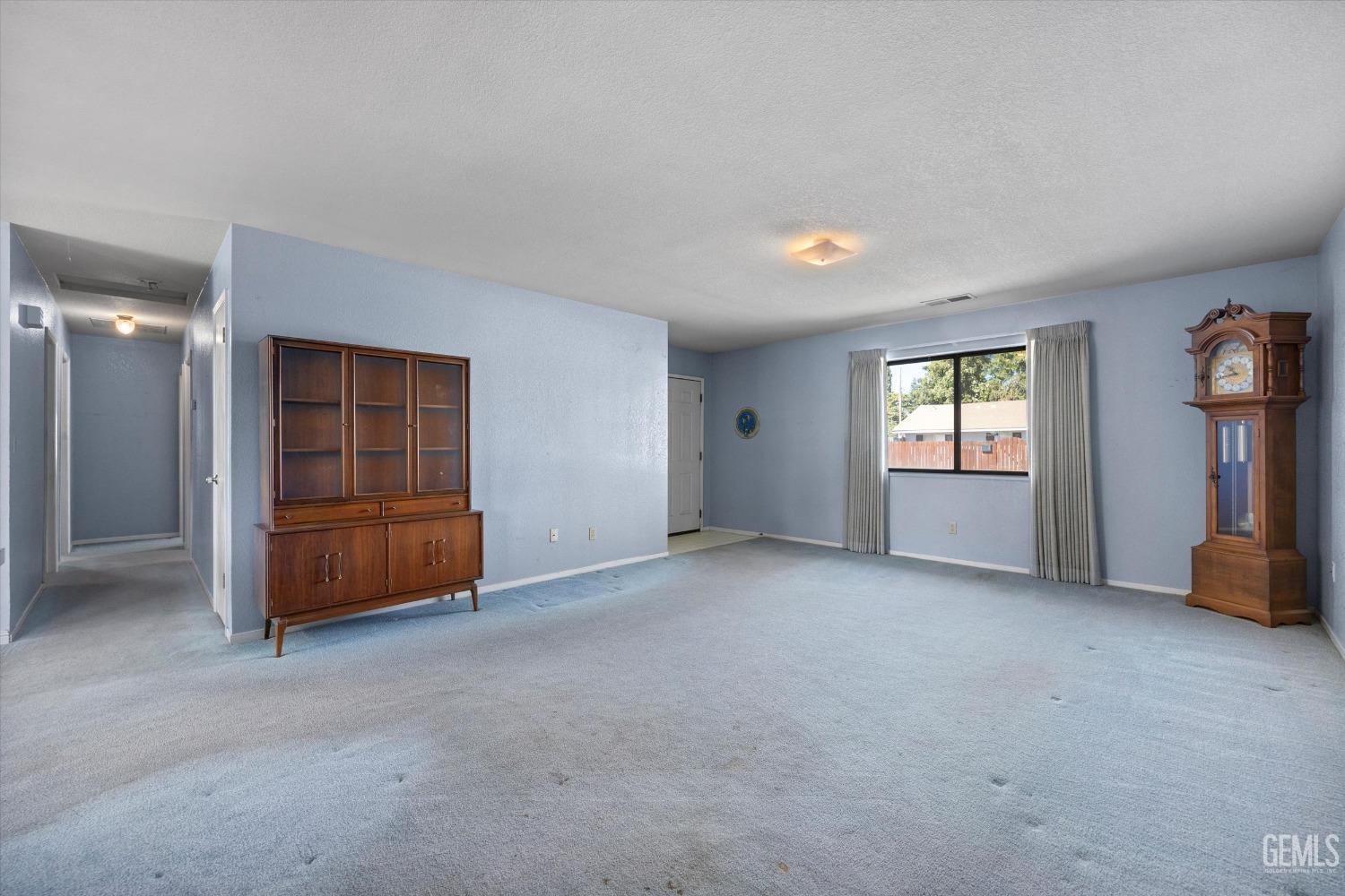 Undisclosed Address Chowchilla, CA 93610 - Photo 7 of 29 a view of an empty room with a window