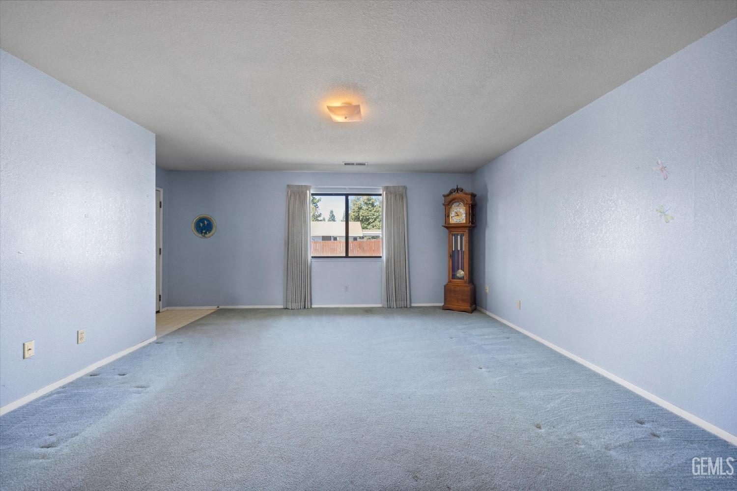 Undisclosed Address Chowchilla, CA 93610 - Photo 8 of 29 an empty room with windows and closet