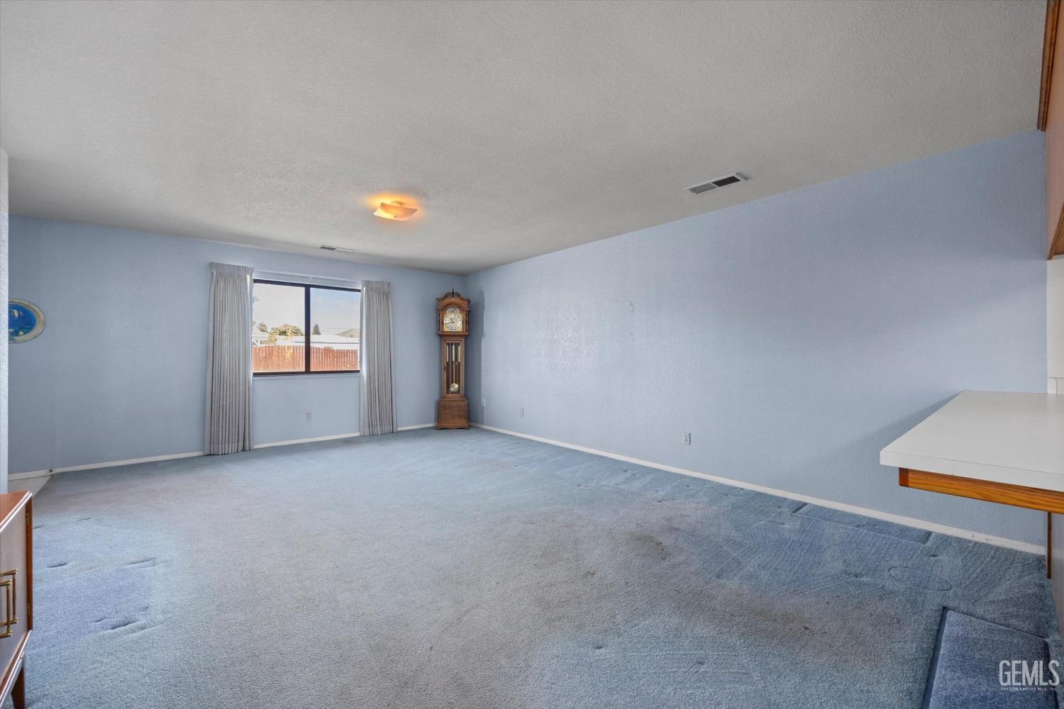Undisclosed Address Chowchilla, CA 93610 - Photo 9 of 29 an empty room with windows and closet