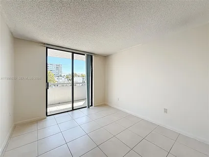 a view of roof deck with seating space and city view