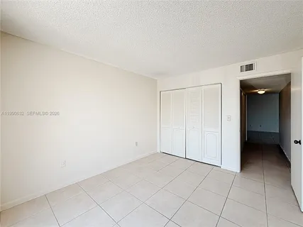 a kitchen with stainless steel appliances a refrigerator and a stove