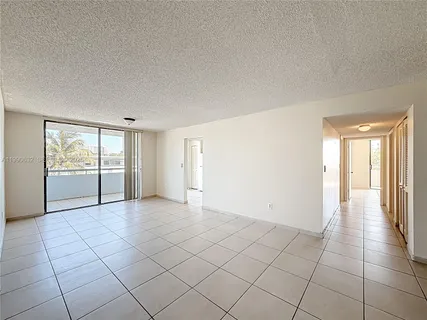 a bathroom with a sink a toilet and a large mirror