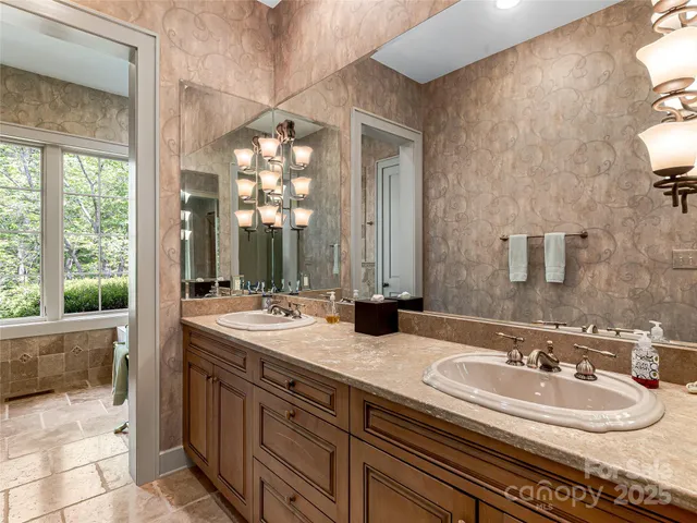 a bathroom with a sink double vanity and a mirror