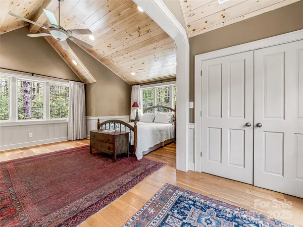 a bedroom with furniture and window