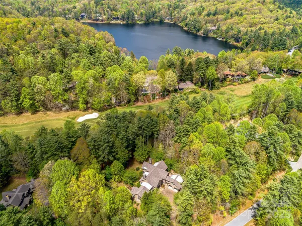 a view of a lake with a yard