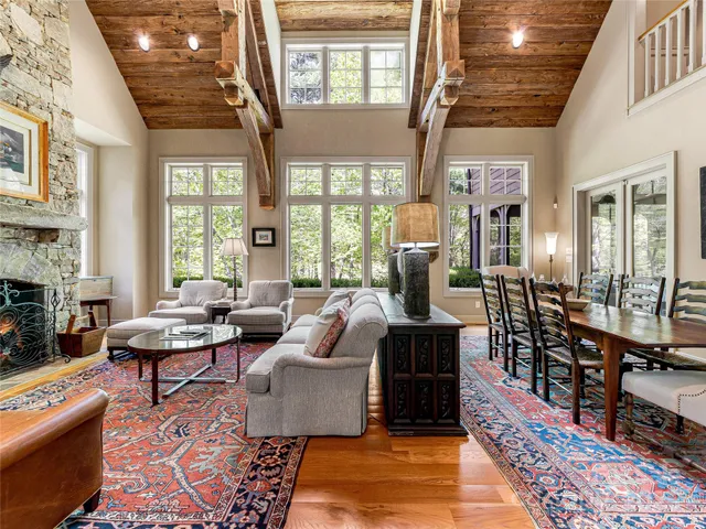 a living room with furniture fireplace and a table