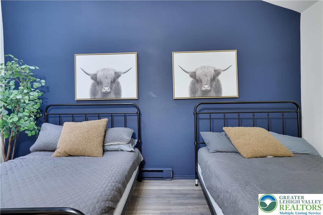 421 King Arthur Road Pocono Lake, PA 18347 - Photo 14 of 29 a bedroom with a bed and painting on the wall