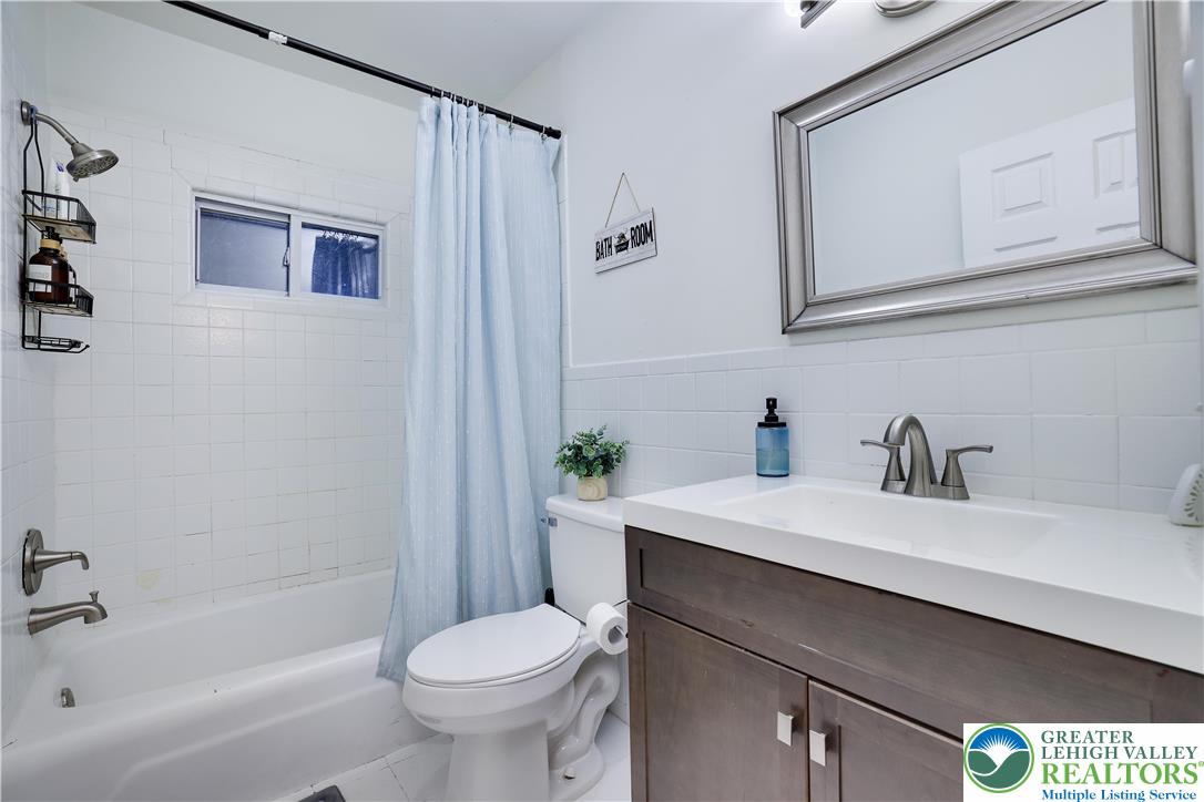 421 King Arthur Road Pocono Lake, PA 18347 - Photo 21 of 29 a bathroom with a sink a toilet and shower