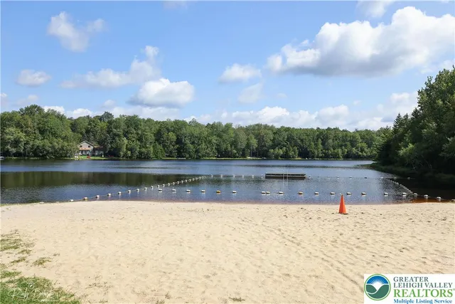 a view of a swimming pool with an outdoor space and seating area