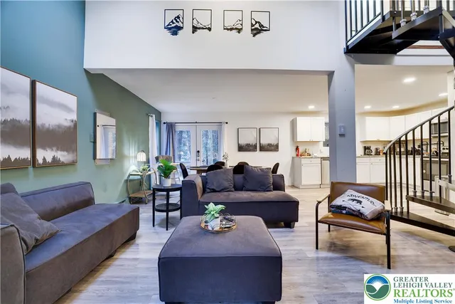 a living room with furniture or couch and a dining table