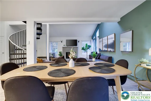 a kitchen with a table chairs and a dining table