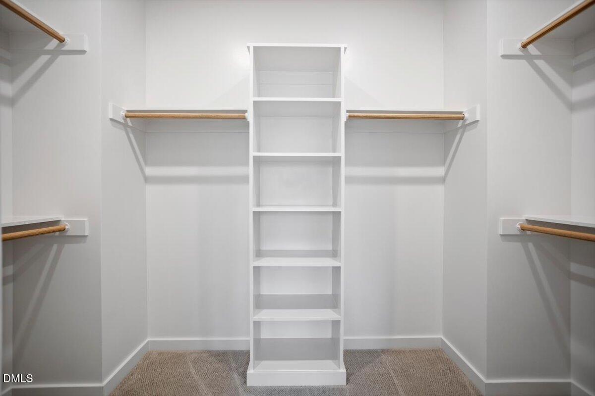 6419 Tanner Oak Lane Raleigh, NC 27613 - Photo 28 of 39 a view of walk in closet with empty racks