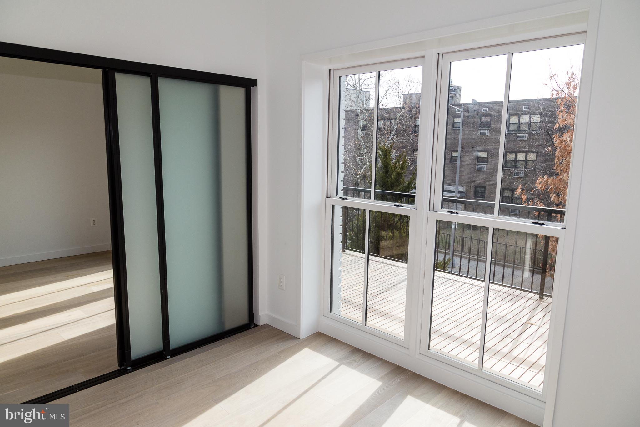 1443 Euclid Street Northwest, Unit 5 Washington, DC 20009 - Photo 6 of 13 a view of empty room with window