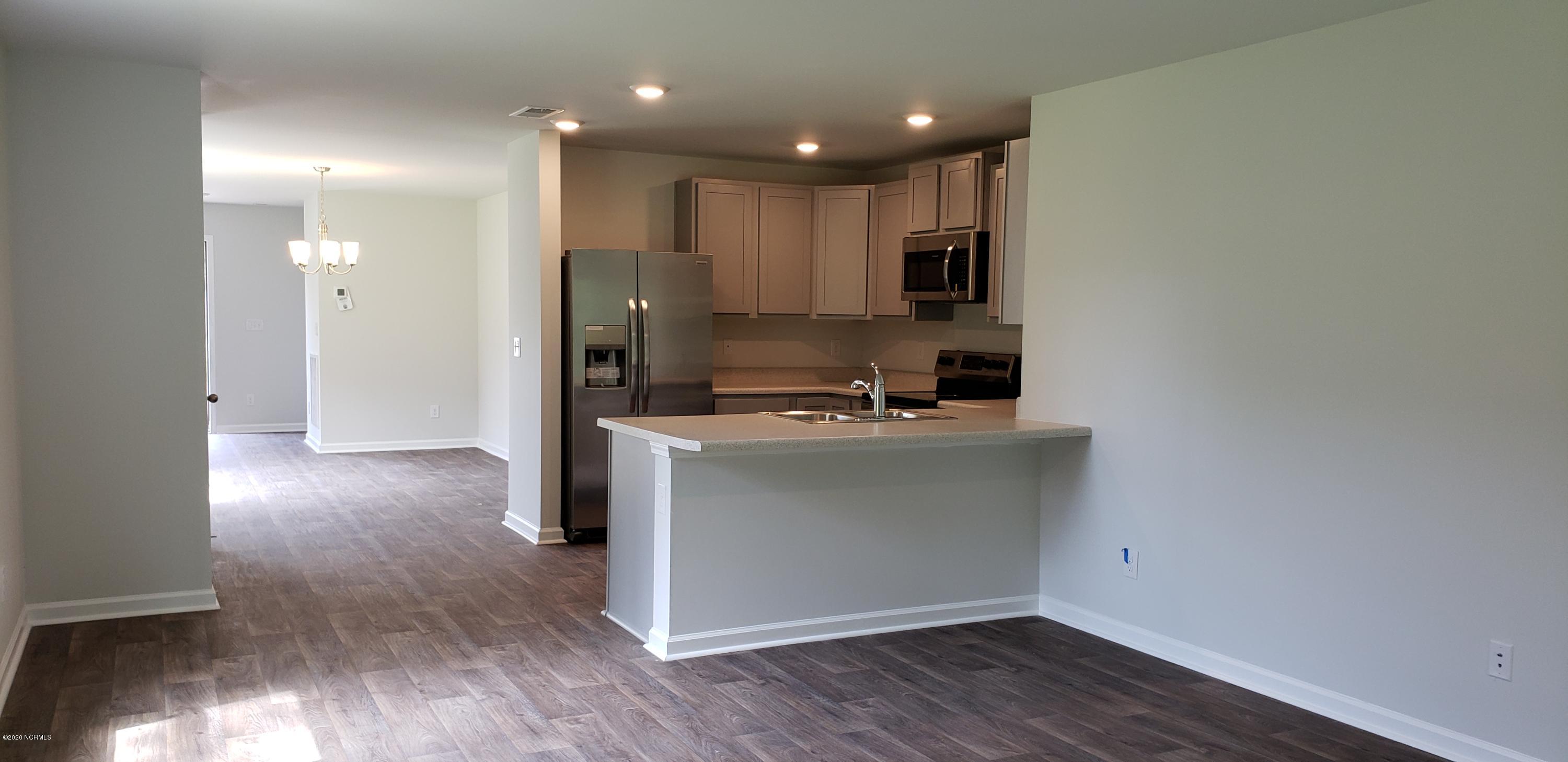 402 Ellis Road Southeast, Unit LOT #49 Bolivia, NC 28422 - Photo 13 of 21 ACTUAL HOME PHOTO. Refrigerator included!