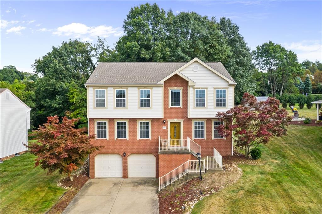 a front view of a house with a yard and porch