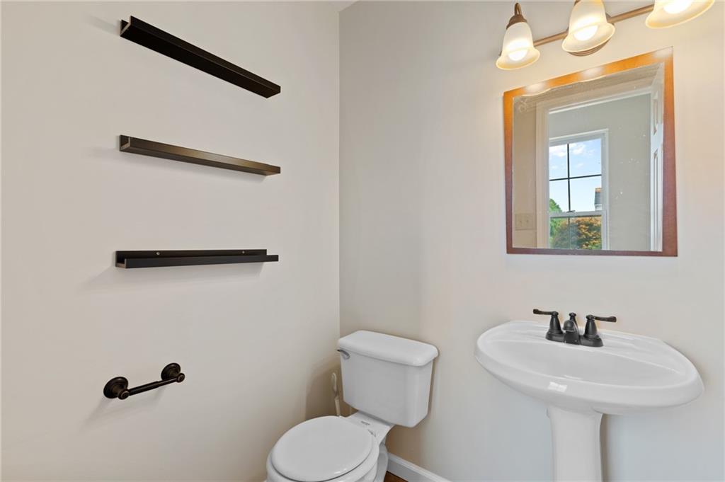 6 Wellington Court McKees Rocks, PA 15136 - Photo 11 of 24 a bathroom with a sink mirror and toilet