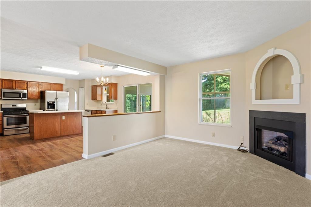 6 Wellington Court McKees Rocks, PA 15136 - Photo 5 of 24 a view of a kitchen with a sink a fireplace and a window