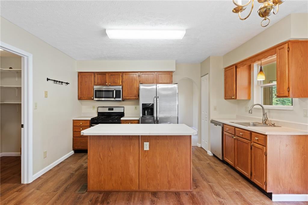 6 Wellington Court McKees Rocks, PA 15136 - Photo 7 of 24 a large kitchen with stainless steel appliances granite countertop a stove a sink dishwasher and a refrigerator