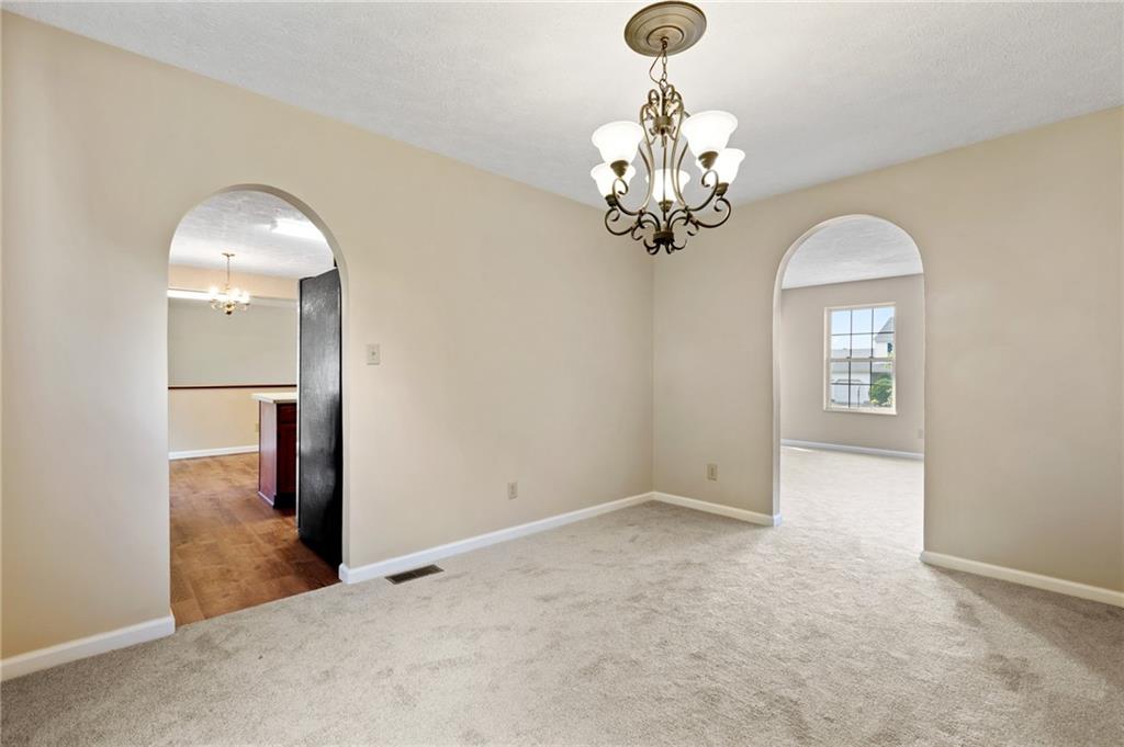 6 Wellington Court McKees Rocks, PA 15136 - Photo 9 of 24 a view of a hallway with wooden floor and a chandelier