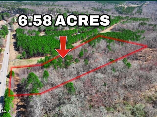 a view of sign board with flower around