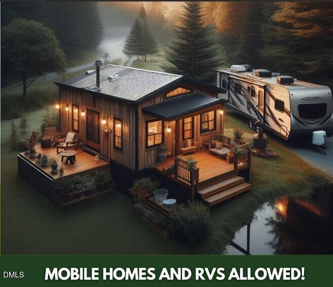 873 Ranch Road Clayton, NC 27520 - Photo 12 of 12 a view of a couches with wooden floor