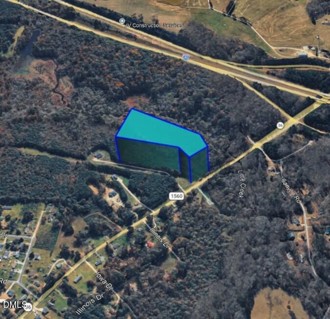 873 Ranch Road Clayton, NC 27520 - Photo 4 of 12 a backyard of a house with a yard fire pit and a stove top oven