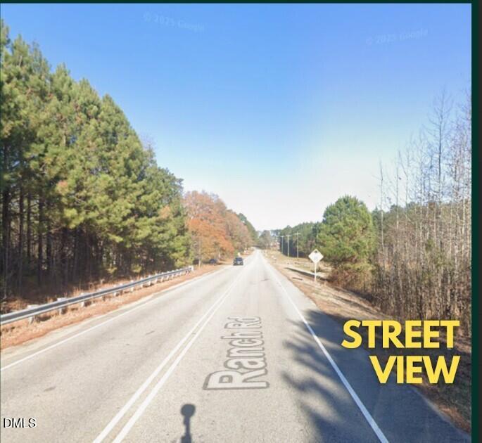 873 Ranch Road Clayton, NC 27520 - Photo 8 of 12 a view of a street with a mountain view