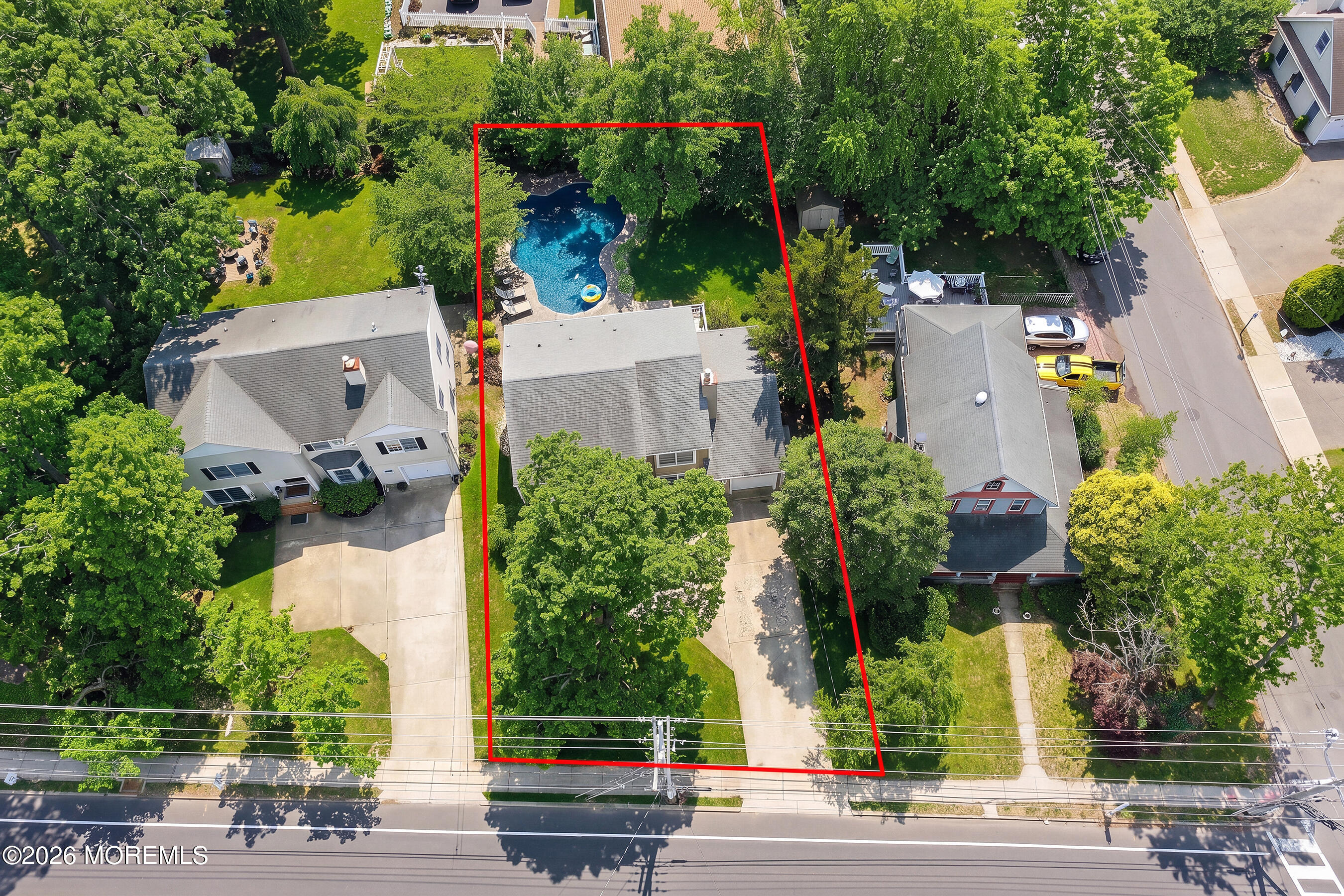 924 Ocean Road Point Pleasant, NJ 08742 - Photo 38 of 56 an aerial view of a house with a yard and large trees