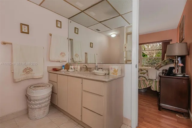 a view of a room with wooden floor and fence