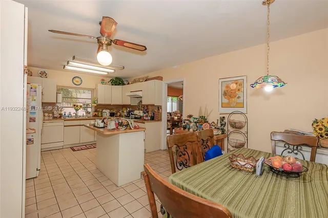 a kitchen with cabinets and window