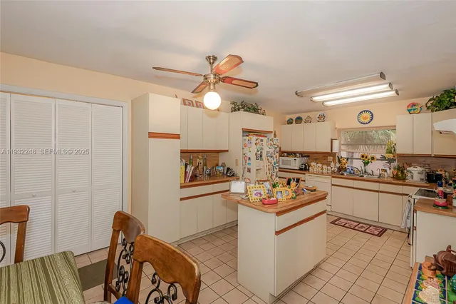 a kitchen with stainless steel appliances a refrigerator and a stove