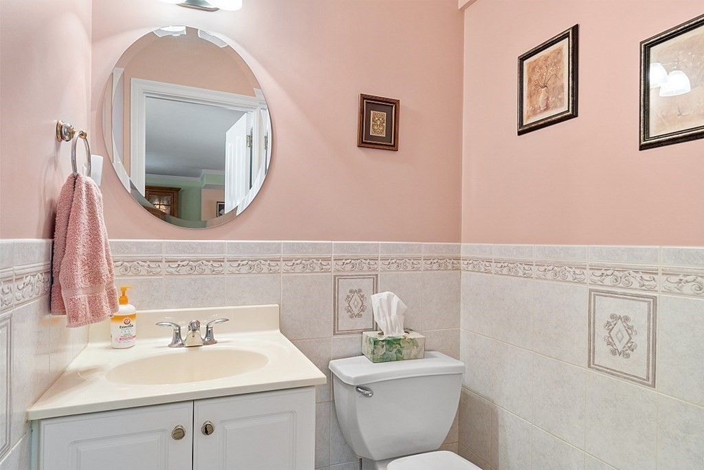 216 Rangeway Road, Unit 183 Billerica, MA 01862 - Photo 12 of 35 a bathroom with a toilet a sink and a mirror