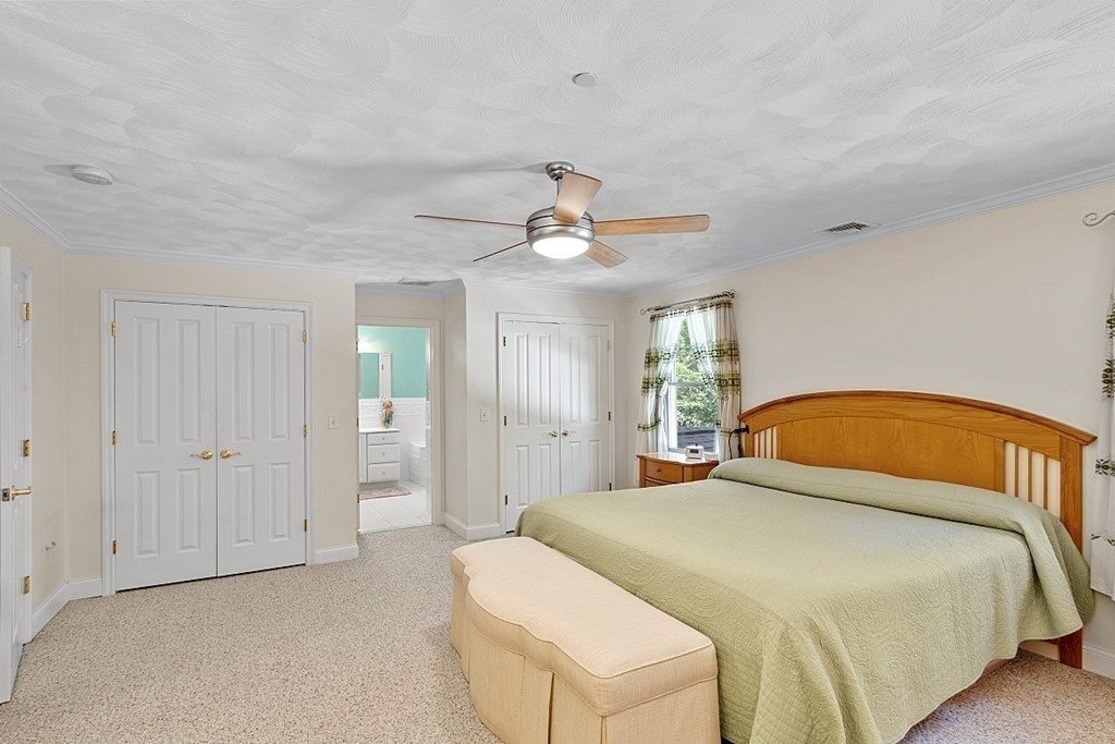 216 Rangeway Road, Unit 183 Billerica, MA 01862 - Photo 15 of 35 a bedroom with a bed and a chandelier