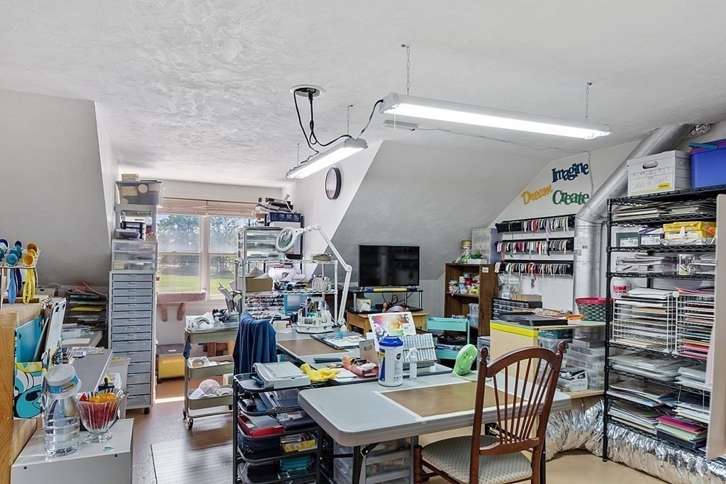 216 Rangeway Road, Unit 183 Billerica, MA 01862 - Photo 25 of 35 a living room with furniture and a book shelf