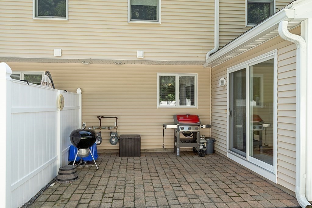 216 Rangeway Road, Unit 183 Billerica, MA 01862 - Photo 26 of 35 a view of a chairs and table in the back yard of the house