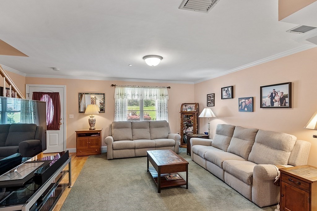 216 Rangeway Road, Unit 183 Billerica, MA 01862 - Photo 3 of 35 a living room with furniture and a flat screen tv
