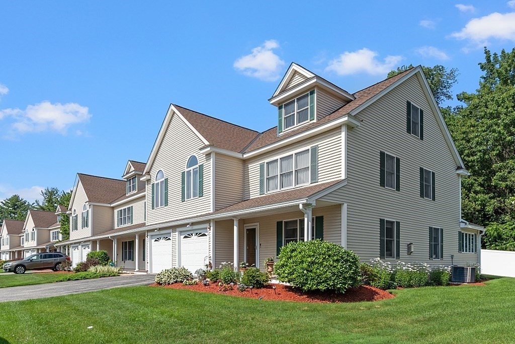 216 Rangeway Road, Unit 183 Billerica, MA 01862 - Photo 34 of 35 a front view of a house with a yard and trees
