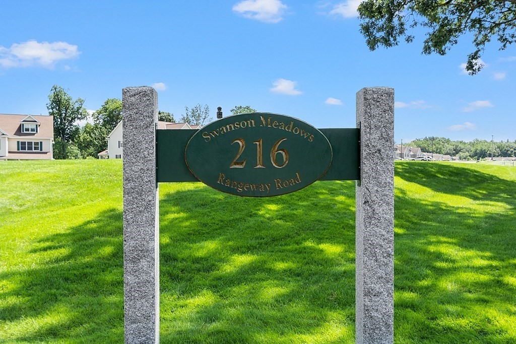 216 Rangeway Road, Unit 183 Billerica, MA 01862 - Photo 35 of 35 a sign board with a play ground in the back