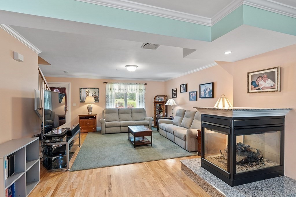 216 Rangeway Road, Unit 183 Billerica, MA 01862 - Photo 4 of 35 a living room with furniture and a fireplace