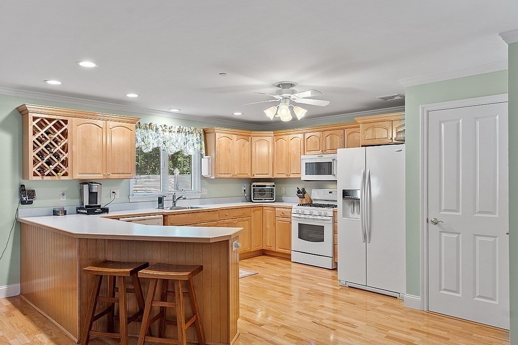216 Rangeway Road, Unit 183 Billerica, MA 01862 - Photo 7 of 35 a kitchen with a center island appliances and cabinets